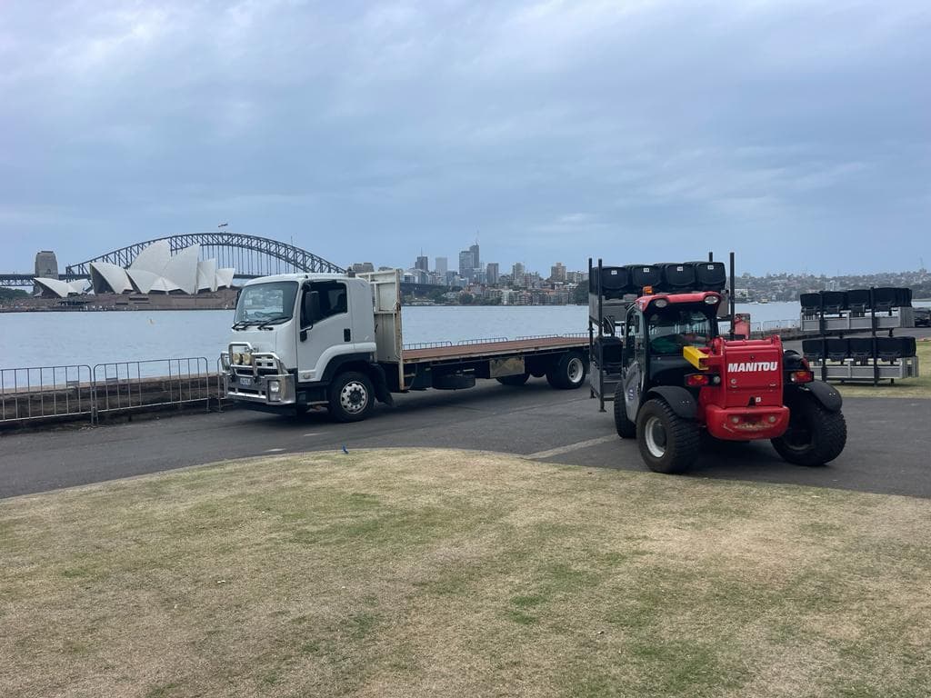 Quick Cargo flat-top truck loaded with building materials